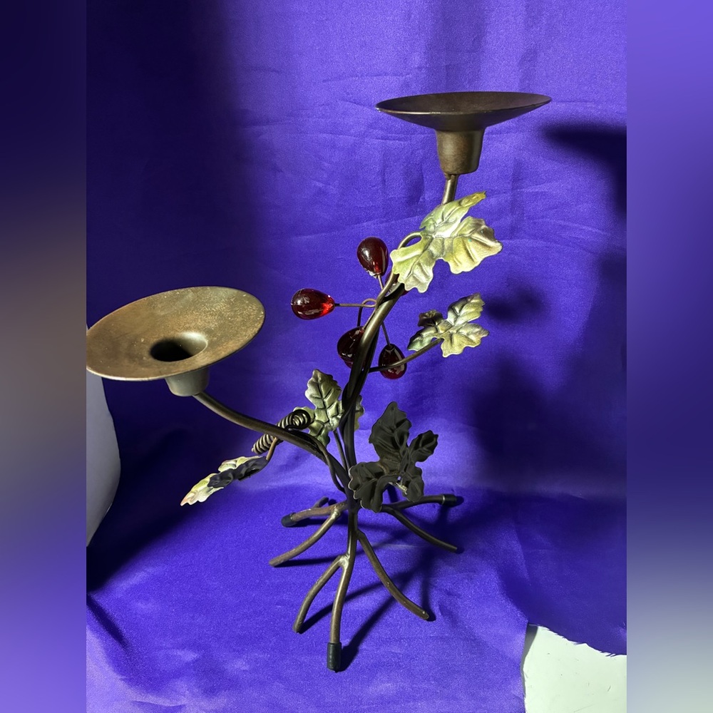 Vintagestyle metal candelabra designed with a botanical "branch and berry" motif
